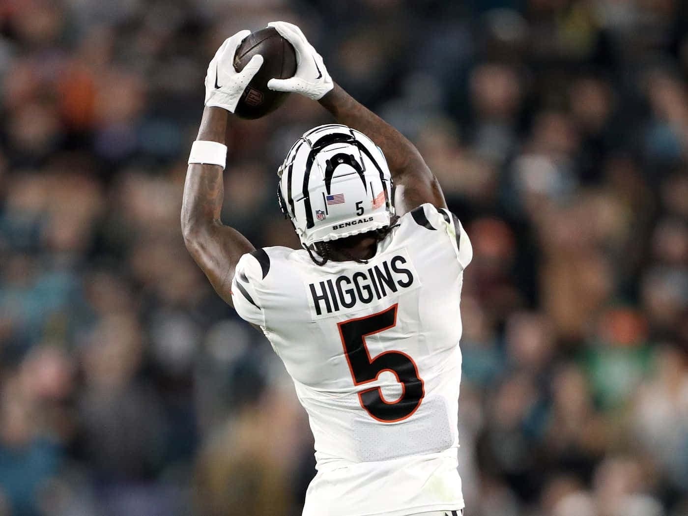Download Tee Higgins Catching Football Wallpaper | Wallpapers.com