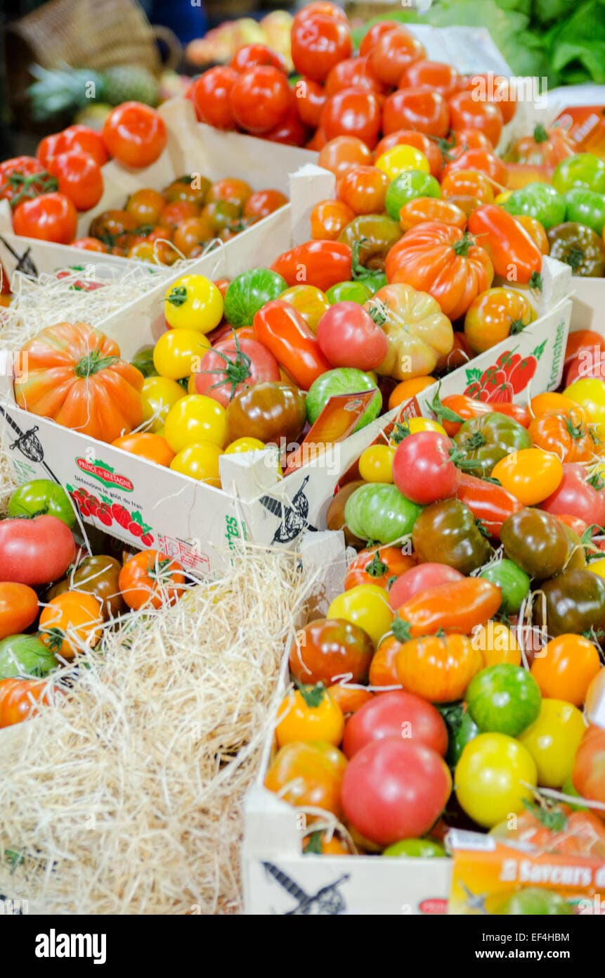 Fresh Heritage tomatoes in rustic crates on a market stall at London's ...