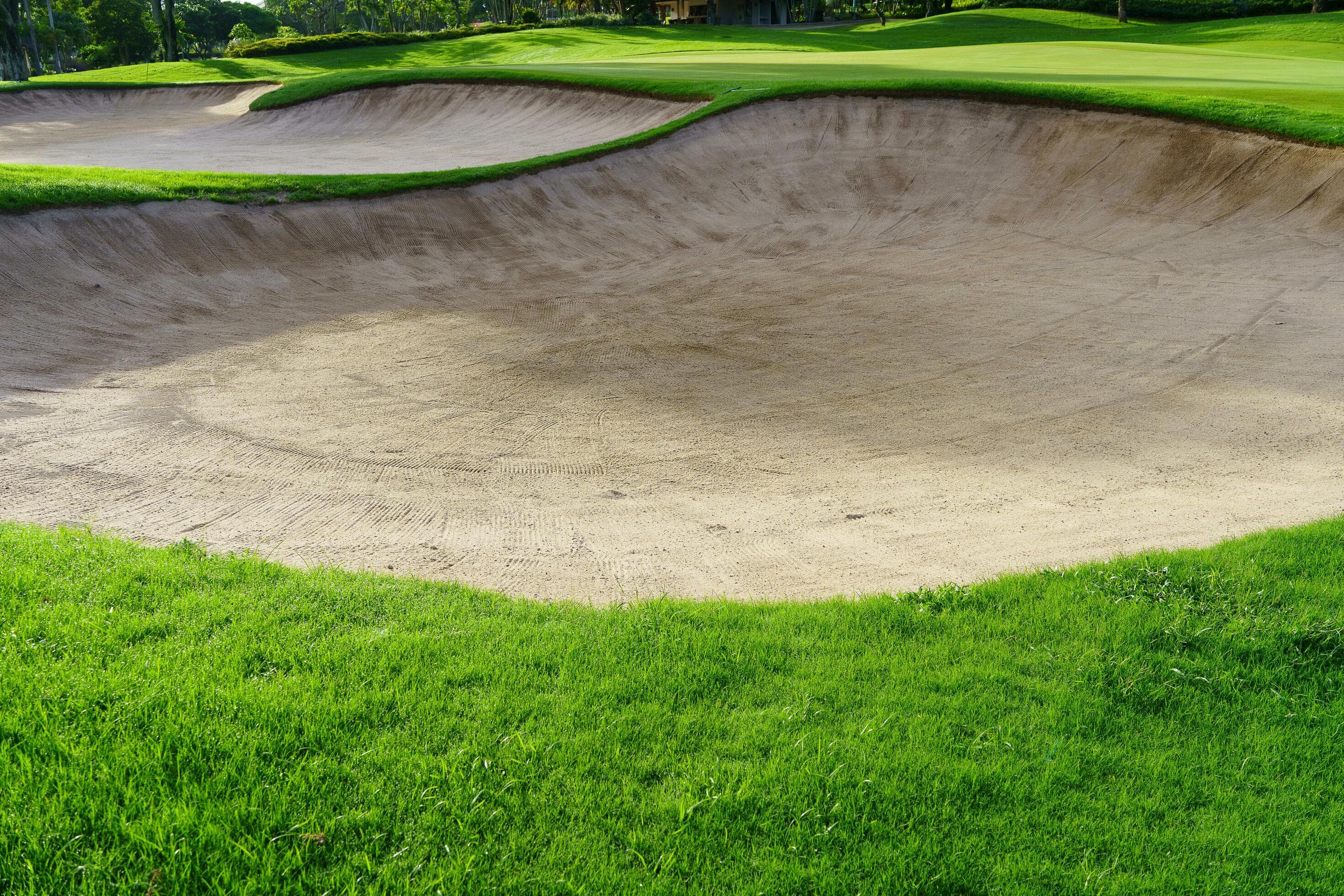 Golf Course Sand Pit Bunkers, green grass surrounding the beautiful ...
